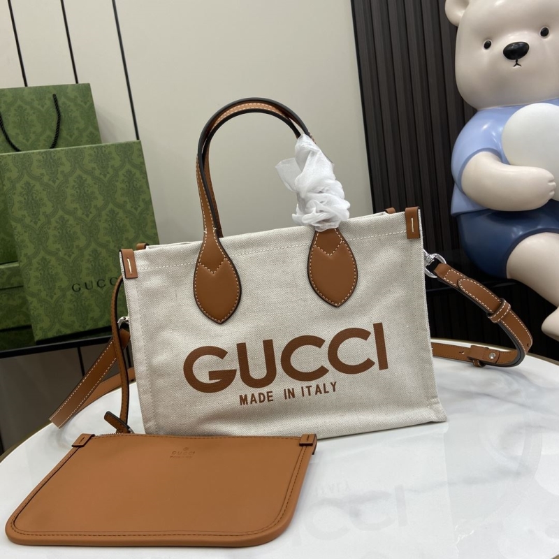 G*u*i shopping bags